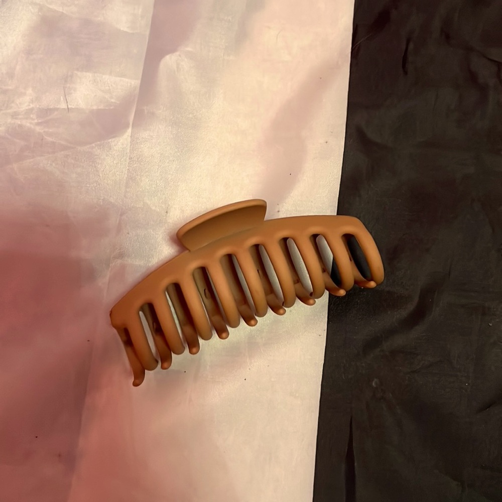 A brown/ beige hair clip
